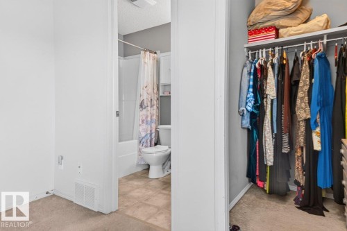 Full bathroom featuring a white tub-shower combination and a standard toilet - 17411 90 Street Nw, Edmonton, AB - Indoor With Storage