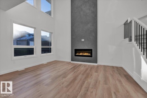 1115 Gyrfalcon Crescent Nw, Edmonton, AB - Indoor Photo Showing Living Room With Fireplace