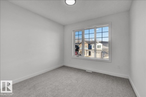 1115 Gyrfalcon Crescent Nw, Edmonton, AB - Indoor Photo Showing Other Room