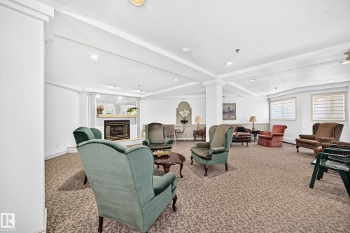 #109 10945 21 Av Nw, Edmonton, AB - Indoor With Fireplace
