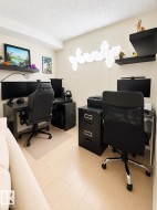 Dedicated office space featuring two distinct workstations - 