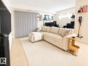 Living area featuring light wood-finish flooring and a neutral color palette - #101 11825 71 St Nw, Edmonton, AB  - Indoor Photo Showing Other Room 