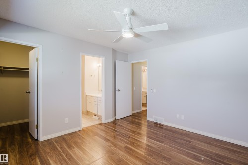 Spacious room featuring wood-finish flooring, light gray walls, and a white ceiling fan with integrated lighting - 337 Pearson Crescent Nw, Edmonton, AB - Indoor Photo Showing Other Room