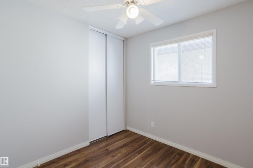 Bedroom featuring wood-finish flooring, white baseboards, and light gray walls - 337 Pearson Crescent Nw, Edmonton, AB - Indoor Photo Showing Other Room