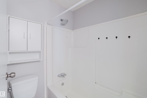 White acrylic tub and shower combination with chrome fixtures - 337 Pearson Crescent Nw, Edmonton, AB - Indoor Photo Showing Other Room
