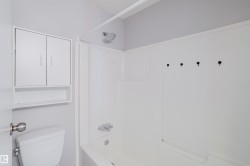 White acrylic tub and shower combination with chrome fixtures - 