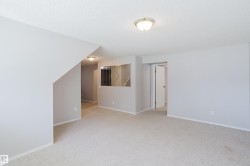 Spacious room with light-toned carpet flooring and painted walls - 
