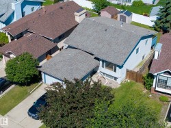 Light blue siding exterior with a shingled roof - 