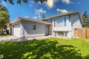 Stucco exterior residence featuring a front lawn and paved driveway - 337 Pearson Crescent Nw, Edmonton, AB  - Outdoor 