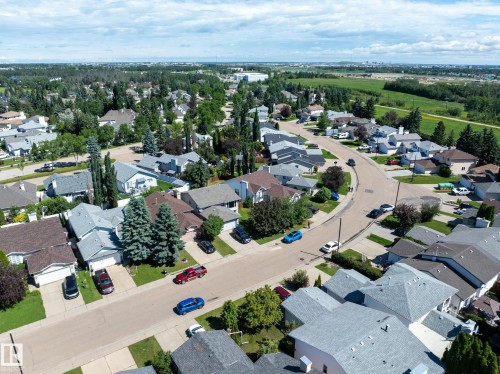 Aerial perspective showcasing an established residential neighborhood with detached homes, mature trees, and paved streets - 337 Pearson Crescent Nw, Edmonton, AB - Outdoor With View