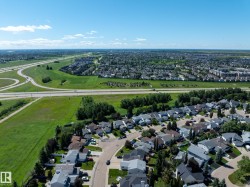 Expansive aerial capturing a suburban neighborhood with varied housing styles - 