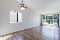 Vaulted ceiling featuring a decorative chandelier - 