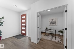 Entryway featuring wood-finish flooring, a contemporary front door with horizontal lites, and a recessed ceiling light - 