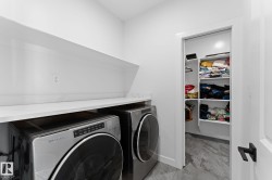 Functional utility space featuring a white countertop with integrated backsplash, an upper storage shelf, and a separate closet with built-in shelving - 