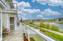 Private balcony with durable concrete flooring and a glass railing system - 