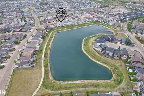 Residential community featuring a prominent central lake - 7622 168A Avenue, Edmonton, AB -  With Body Of Water With View