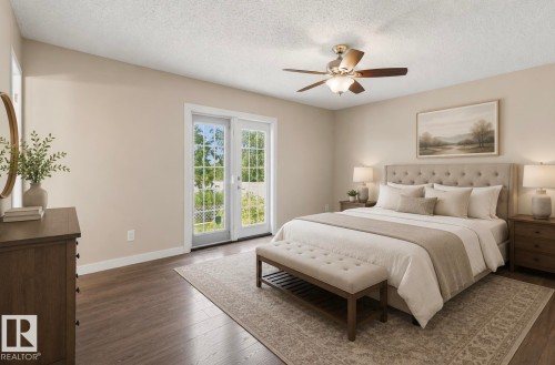Spacious room with wood-finish flooring and a ceiling fan - 10211 95 Ave, Morinville, AB - Indoor Photo Showing Bedroom