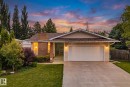 Ranch-style residence featuring a brick facade, attached two-car garage, and a concrete driveway - 7306 21 Avenue Nw, Edmonton, AB  - Outdoor 