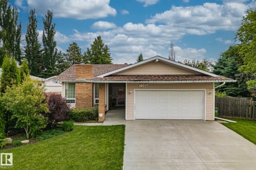 Single-story residence featuring a two-car garage, concrete driveway, and brick and siding exterior - 7306 21 Avenue Nw, Edmonton, AB - Outdoor