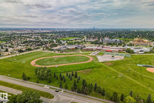 Expansive aerial perspective showcasing a residential neighborhood with green spaces - 7306 21 Avenue Nw, Edmonton, AB - Outdoor With View
