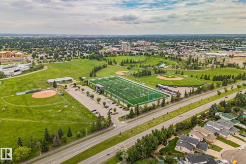 Aerial perspective of a developed urban area featuring multiple sports fields and residential properties - 7306 21 Avenue Nw, Edmonton, AB - Outdoor With View