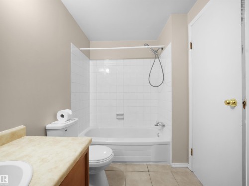 Full bathroom with an integrated tub and shower featuring white subway tile surround - 3509 43A Avenue Nw, Edmonton, AB - Indoor Photo Showing Bathroom