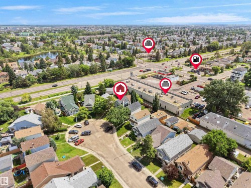 Aerial view of a residential neighborhood with mixed architectural styles, mature trees, and paved streets - 3509 43A Avenue Nw, Edmonton, AB - Outdoor With View