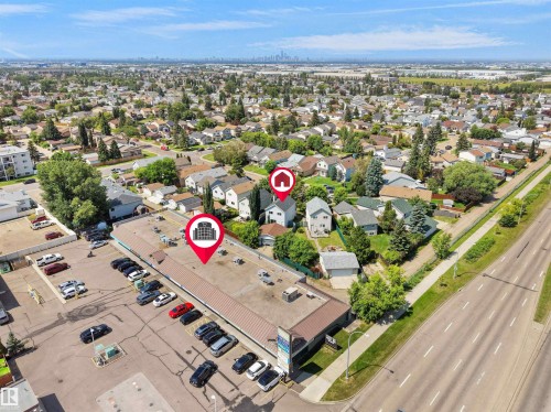 Aerial perspective showcasing a mixed-use neighborhood with residential properties and commercial structures - 3509 43A Avenue Nw, Edmonton, AB - Outdoor With View