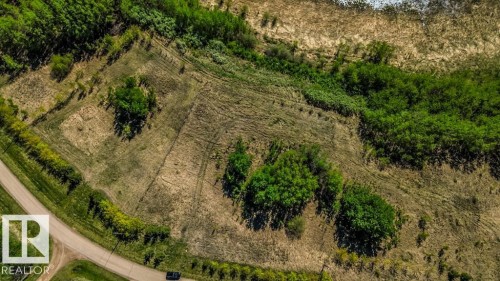 Expansive cleared lot with perimeter fencing and natural tree lines - 705 59128 Rng Rd 95, Rural St. Paul County, AB 