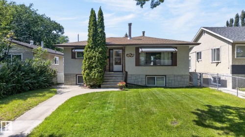 Single-story residence featuring a brown shingle roof and light gray stucco exterior - 12908 104 Street Nw, Edmonton, AB - Outdoor