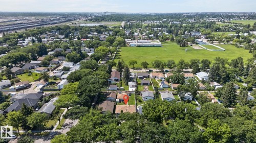 Aerial perspective highlighting a residential neighborhood with ample green space - 12908 104 Street Nw, Edmonton, AB - Outdoor With View
