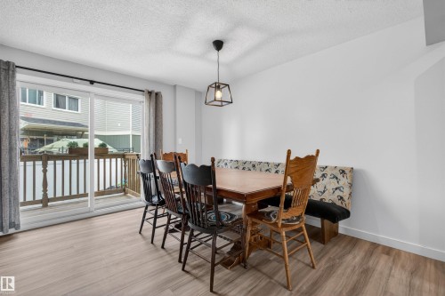 Bright dining area featuring light wood-finish flooring - 18116 81 Avenue, Edmonton, AB 
