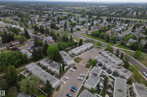 Aerial perspective showcasing an expansive residential area featuring multiple housing types - 18116 81 Avenue, Edmonton, AB 