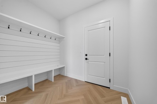 Built-in storage bench with overhead shelf and multiple hooks - 2808 191 Street Nw, Edmonton, AB - Indoor Photo Showing Other Room