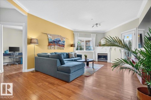 #306 10116 80 Av Nw, Edmonton, AB - Indoor Photo Showing Living Room With Fireplace