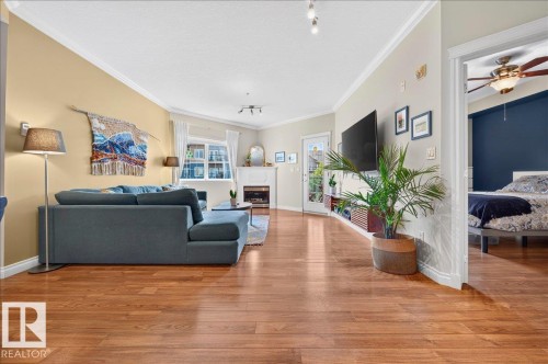 #306 10116 80 Av Nw, Edmonton, AB - Indoor Photo Showing Living Room With Fireplace