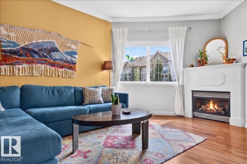 #306 10116 80 Av Nw, Edmonton, AB - Indoor Photo Showing Living Room With Fireplace