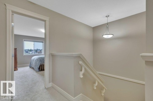 Bright stairwell to second floor - #10 15151 43 St Nw, Edmonton, AB - Indoor Photo Showing Other Room