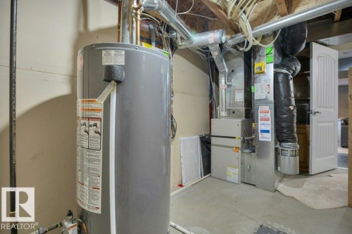 With ample storage - #10 15151 43 St Nw, Edmonton, AB - Indoor Photo Showing Basement