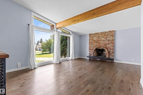 11427 35 Avenue Nw, Edmonton, AB - Indoor Photo Showing Living Room With Fireplace