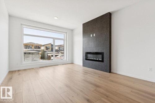 7444 Klapstein Crescent Sw, Edmonton, AB - Indoor Photo Showing Living Room With Fireplace