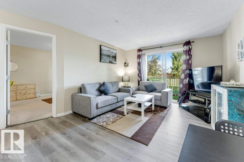 #233 3425 19 St Nw, Edmonton, AB - Indoor Photo Showing Living Room