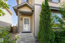 Front entry with covered porch featuring stone steps - 