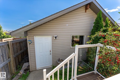 Exterior building with horizontal siding and a gable roofline - 4317 152 Avenue Nw, Edmonton, AB - Outdoor With Exterior