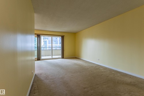 Expansive room featuring light-colored walls and carpeted flooring - #1210 10140 120 St Nw, Edmonton, AB - Indoor Photo Showing Other Room