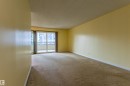 Expansive room featuring light-colored walls and carpeted flooring - #1210 10140 120 St Nw, Edmonton, AB  - Indoor Photo Showing Other Room 