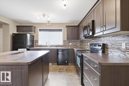 331 Southfork Drive, Leduc, AB - Indoor Photo Showing Kitchen With Double Sink With Upgraded Kitchen