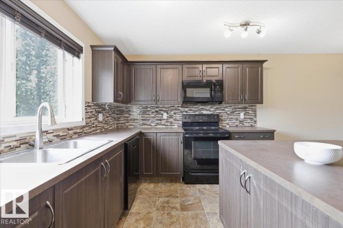 331 Southfork Drive, Leduc, AB - Indoor Photo Showing Kitchen With Double Sink With Upgraded Kitchen