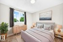 Spacious bedroom featuring light neutral walls and textured carpeting - 3119 144 Avenue Nw, Edmonton, AB  - Indoor Photo Showing Bedroom 