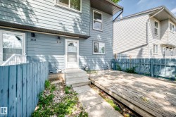Rear wood deck with a partial wooden fence - 
